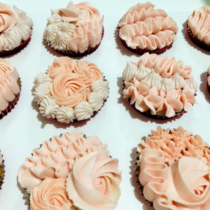 Delicious Chocolate Cupcakes Decorated with Red Rosettes