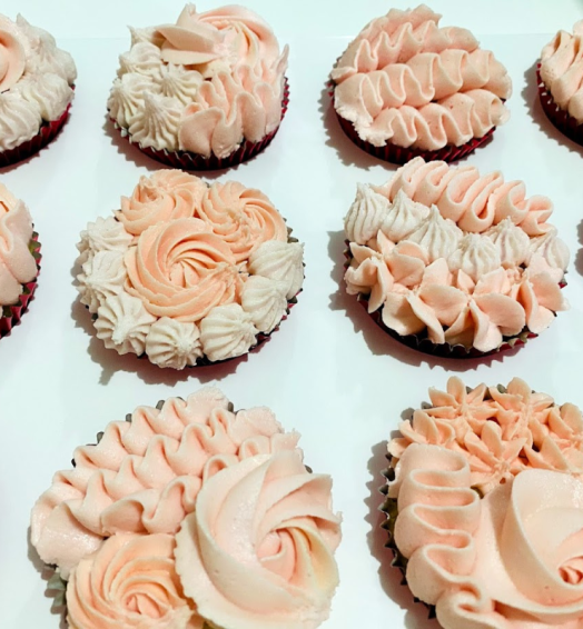 Delicious Chocolate Cupcakes Decorated with Red Rosettes